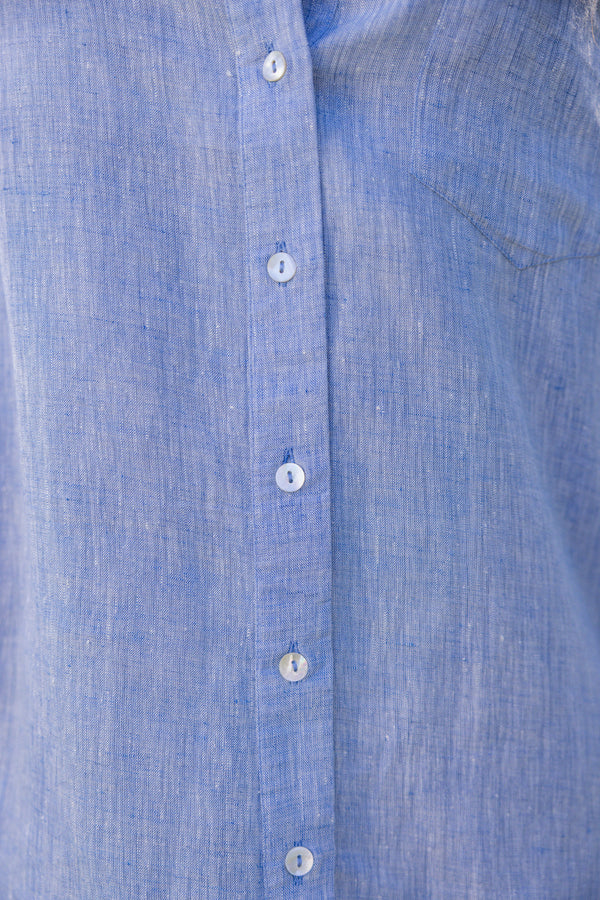 Close-up of a UPF 50+blue button-up dress with sun protection 