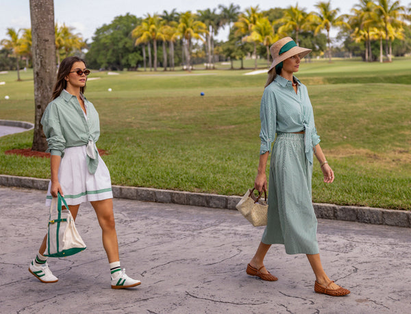 Woman wearing a UPF 50+ green stripe  shirt with sun protection on the country club