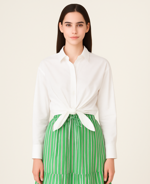 Woman wearing Crisp white UPF 50+ top and green skirt with sun protection on a white background